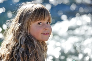 Girl of about ten with freckles and long hair.